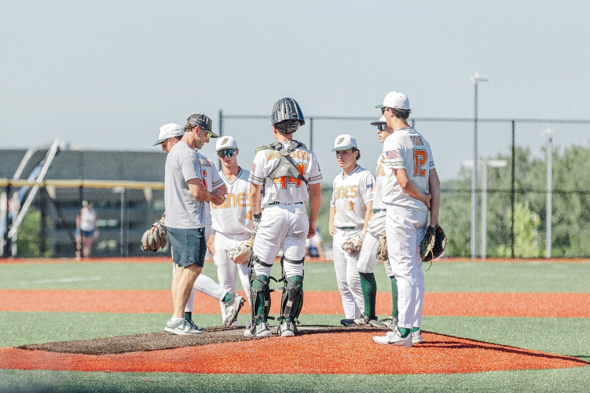 Ben Beauchamp talking with his players during a mound visit