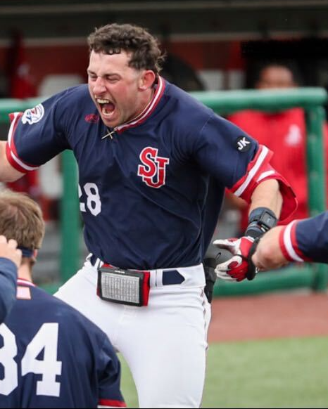Ben Beauchamp celebrating in the dugout